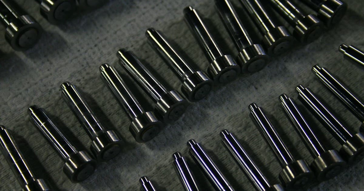 Precision stainless steel CNC machined components showing bright surface finish and close-tolerance features