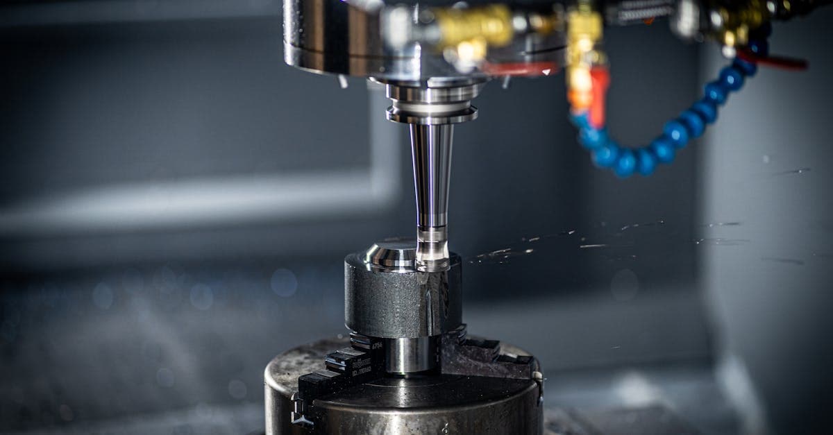 CNC milling machine with spindle and workpiece in a machine shop